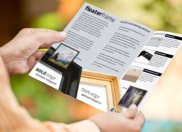two hands holding a trifold brochure